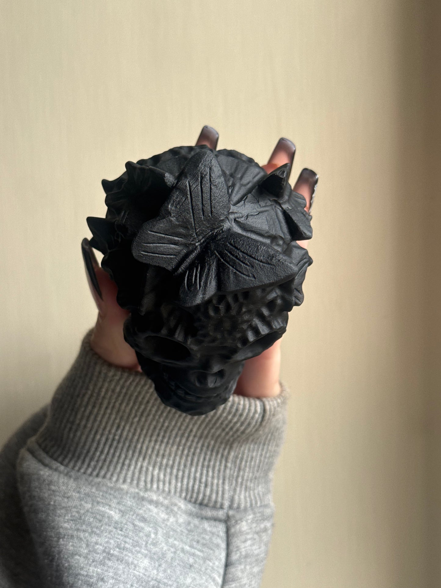 Black obsidian butterfly skull carving