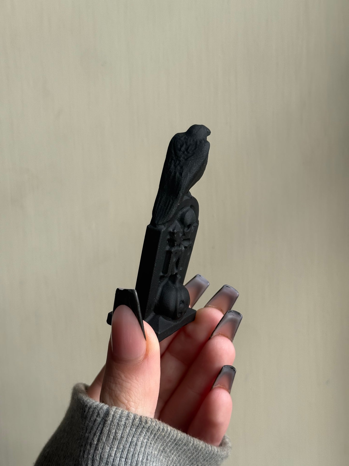 Black obsidian grave stone carving
