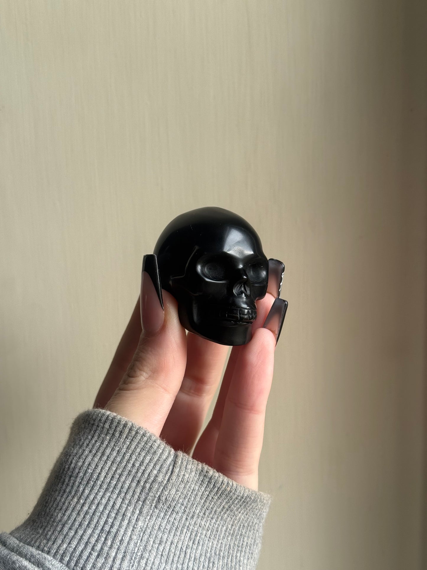 Black obsidian skull carving