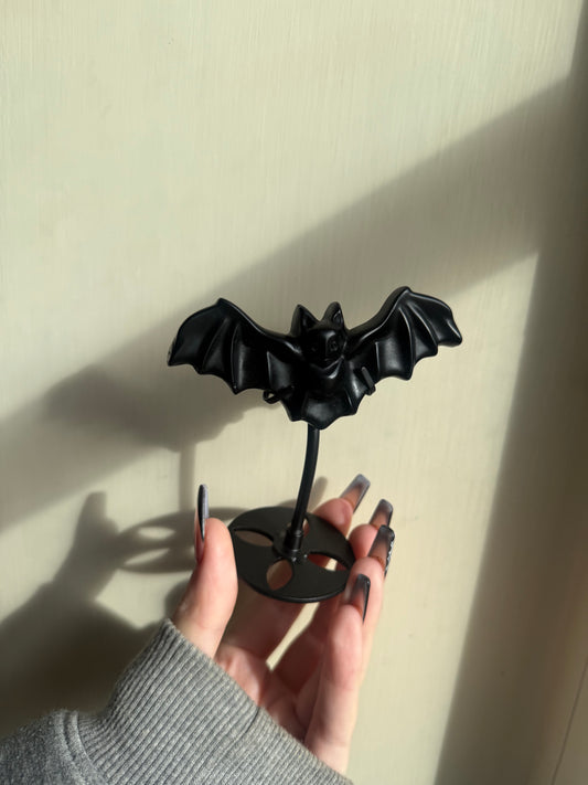 Black obsidian bat on stand