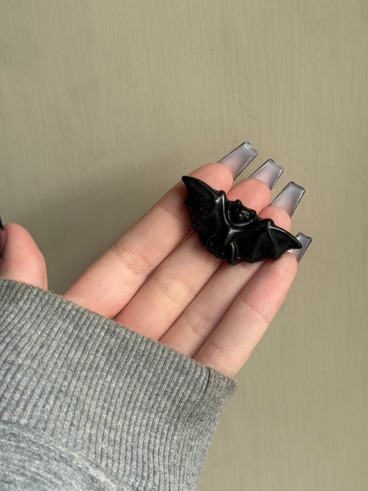 Black obsidian bat carving