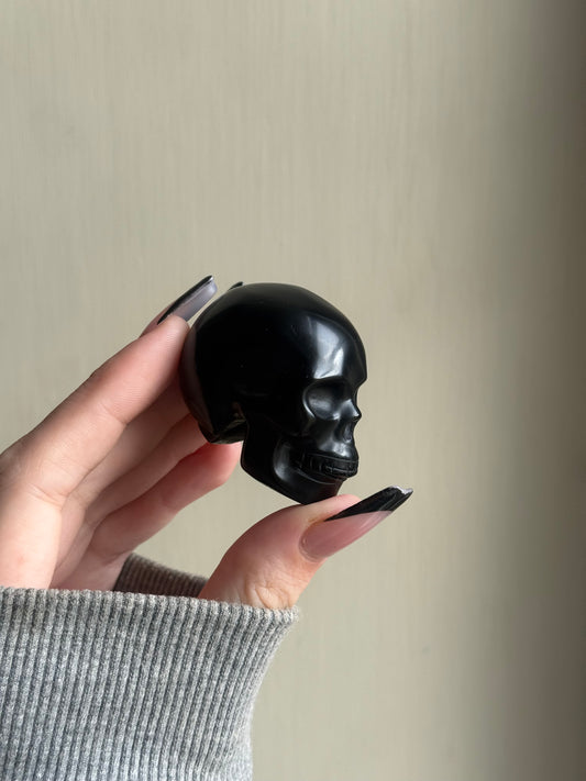 Black obsidian skull carving