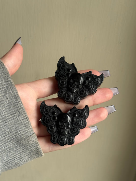 Black obsidian skull moth carving
