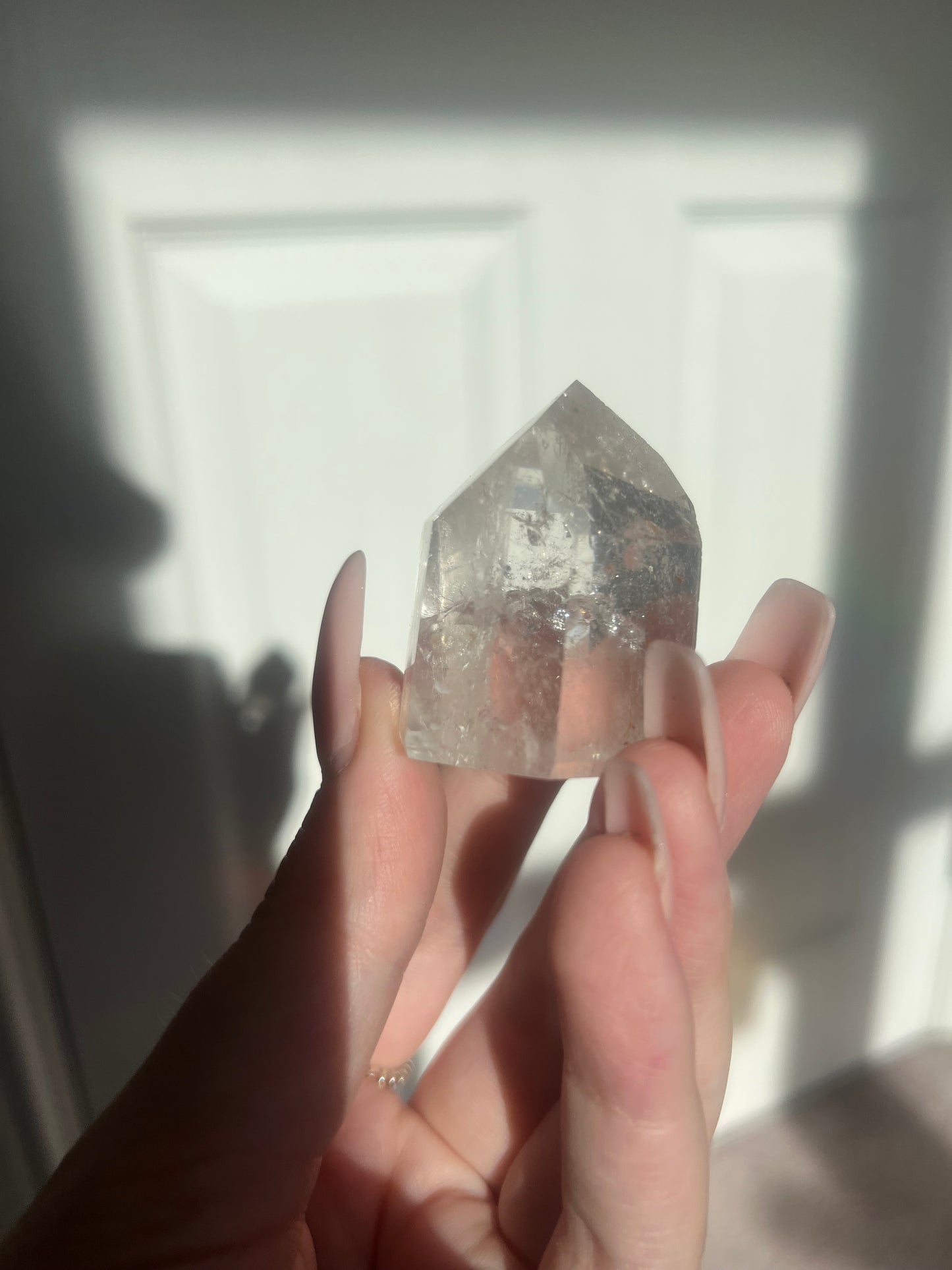 Clear quartz point with iron inclusions