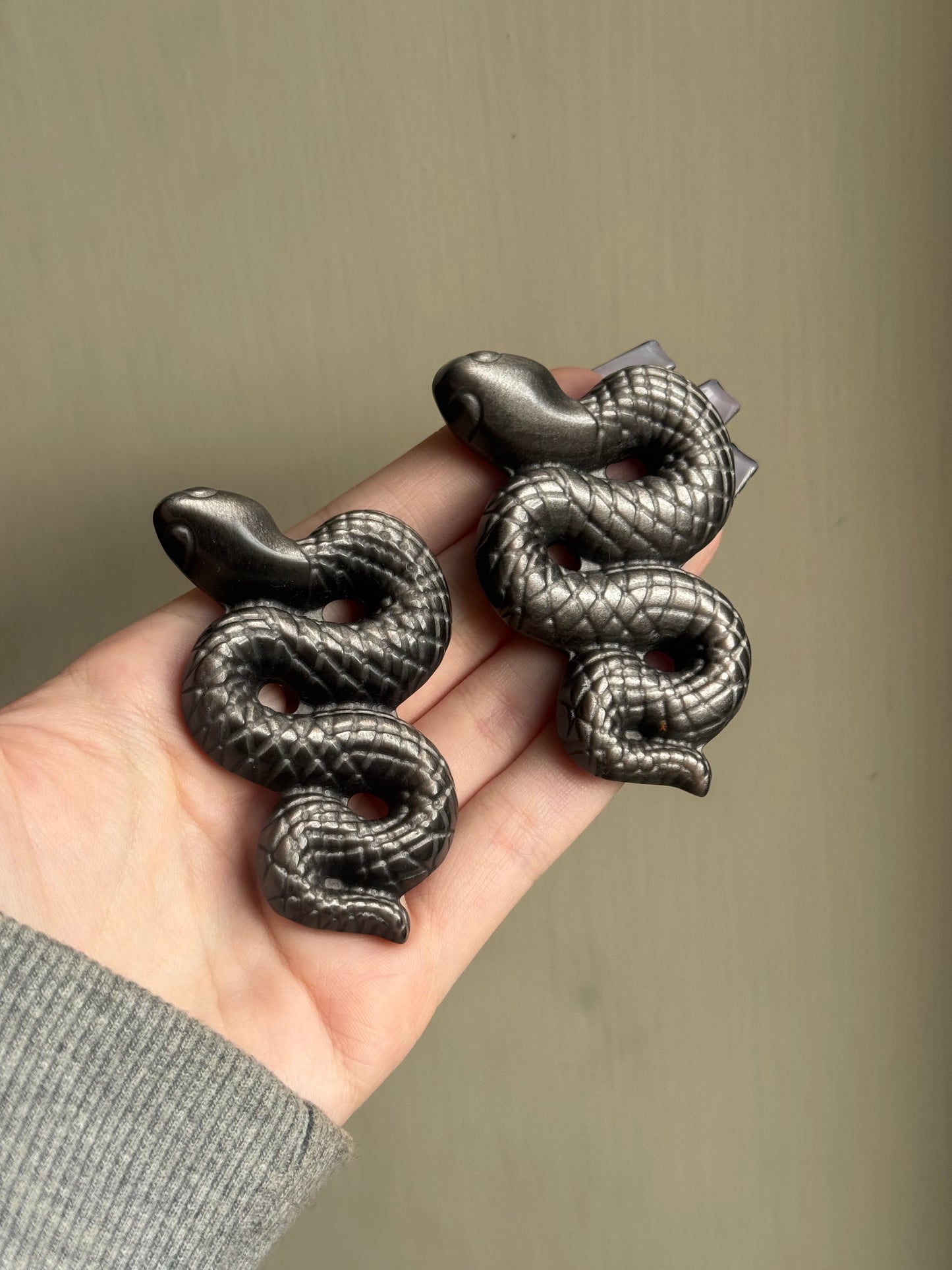 Silver sheen obsidian snake carving