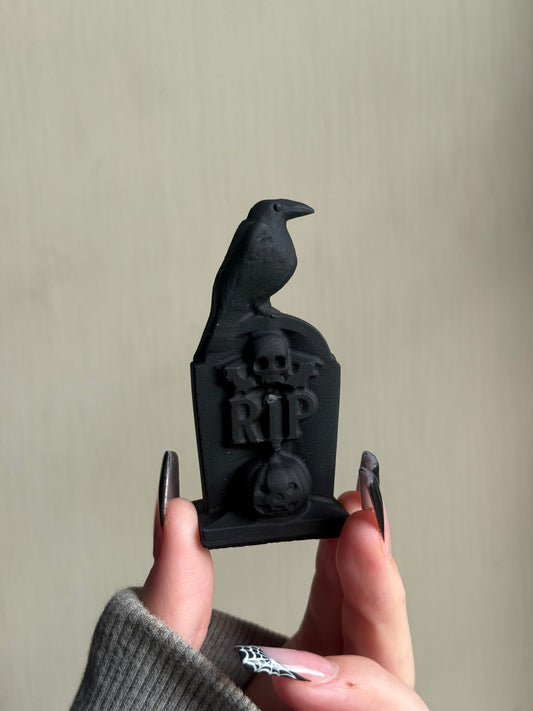 Black obsidian grave stone carving